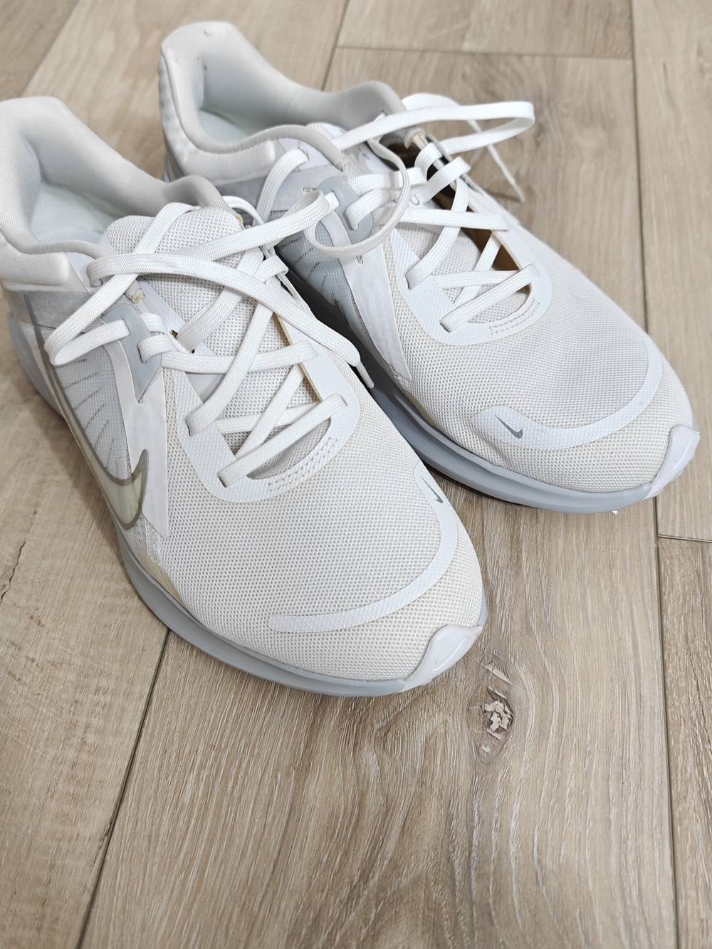Nike Women's White Athletic Sneakers with Metallic Swoosh